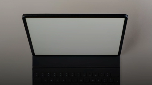 A laptop computer sitting on top of a table