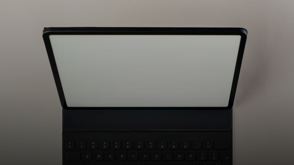 A laptop computer sitting on top of a table