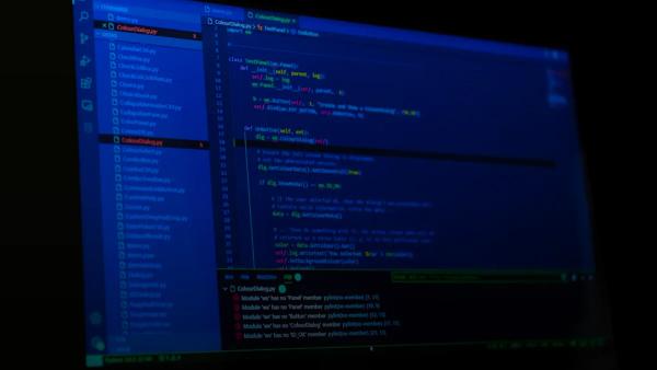 macbook terminal dark code screen programmer open source — illustration for article on Hermes Agent Desktop
