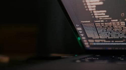 Laptop screen displaying lines of code