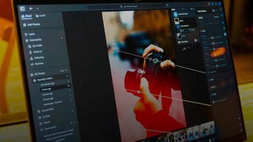 Photo editing software is shown on a laptop screen