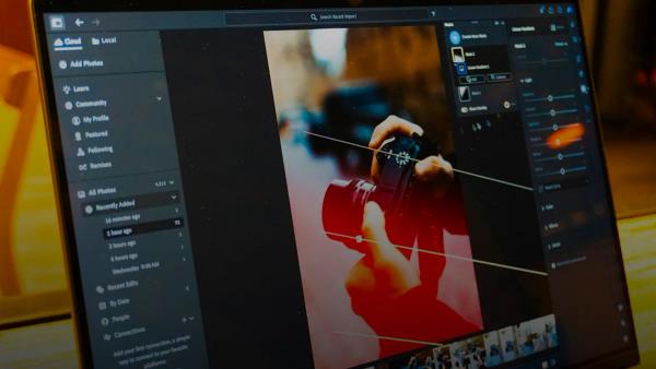 Photo editing software is shown on a laptop screen