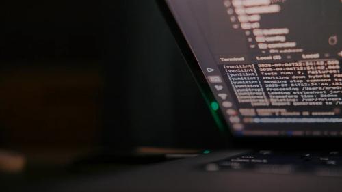 Laptop screen displaying lines of code