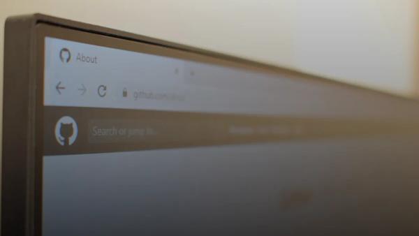 github pull request review laptop screen — illustration for article on Stacked PRs on GitHub [2026]: