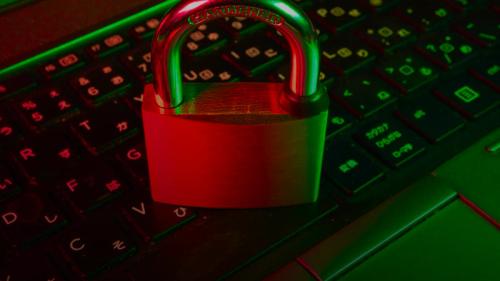 red padlock on black computer keyboard