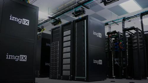 Rows of black server racks with white logos in a data center