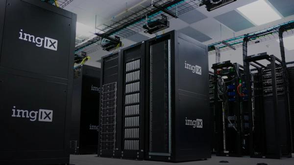Rows of black server racks with white logos in a data center