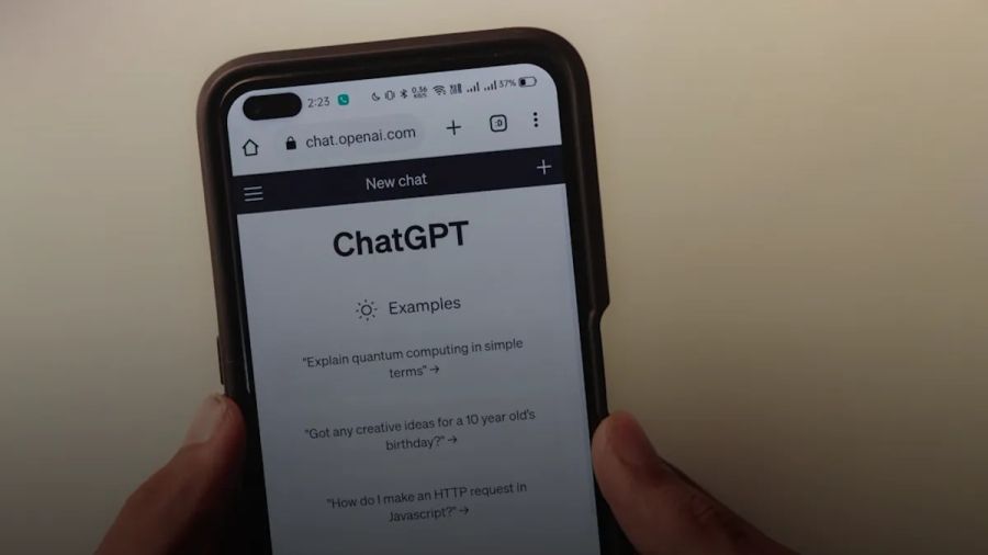 a person holding a cell phone with a chat app on the screen