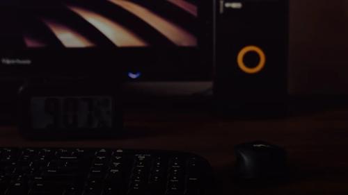 a computer keyboard and mouse on a desk