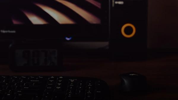 a computer keyboard and mouse on a desk