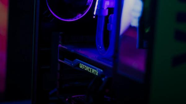a close up of a computer with a purple light