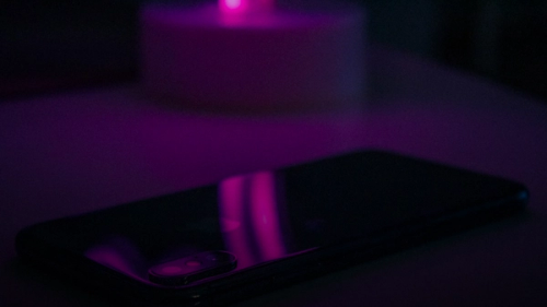 space gray iPhone X on white surface