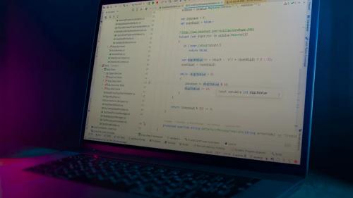 Laptop screen displaying lines of code