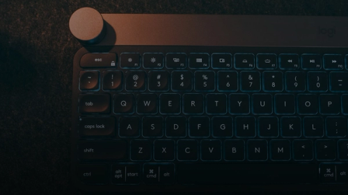 A computer keyboard sitting on top of a table