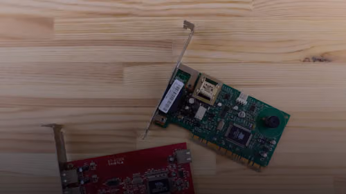 a raspberry board and a mouse on a wooden surface