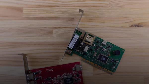 a raspberry board and a mouse on a wooden surface