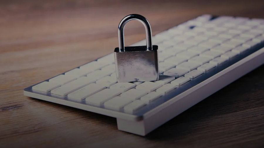 a computer keyboard with a padlock on top of it