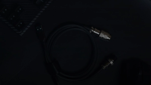 a close up of a cord and a mouse on a table