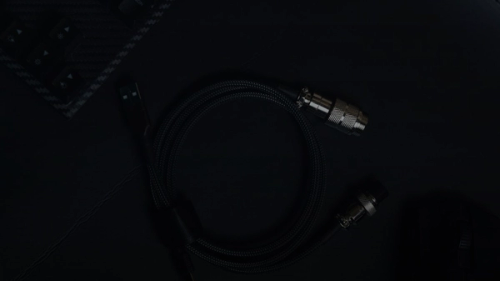 a close up of a cord and a mouse on a table