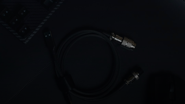 a close up of a cord and a mouse on a table