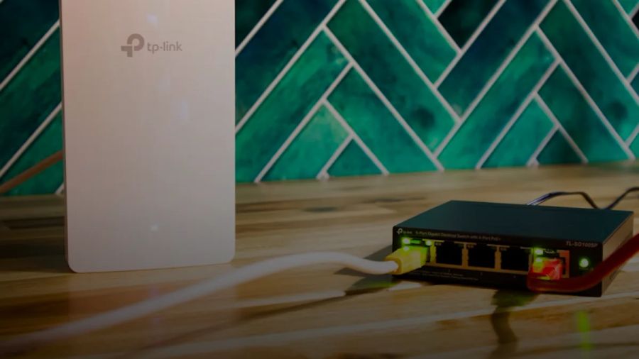 A wi-fi router and a network switch sit side-by-side