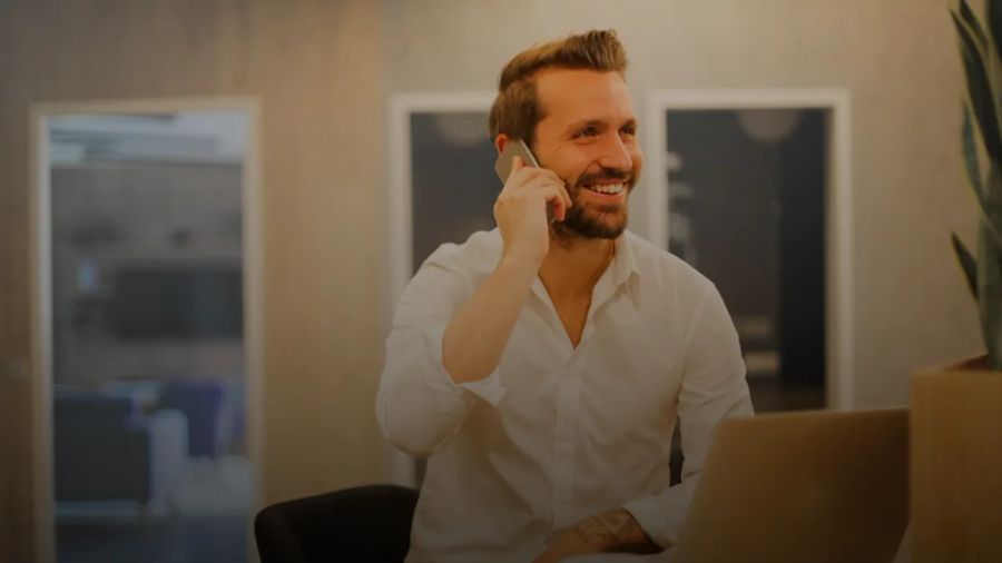 man using smartphone on chair