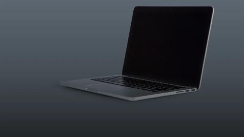 an open laptop computer sitting on top of a table