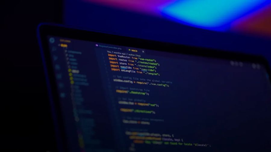 laptop screen displaying colorful code