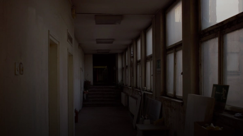 a long hallway with a bunch of windows