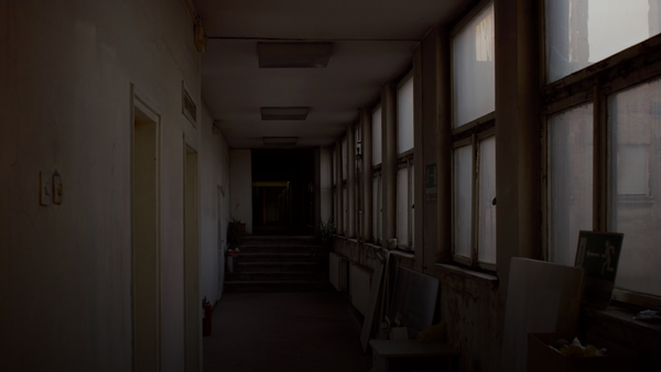 a long hallway with a bunch of windows