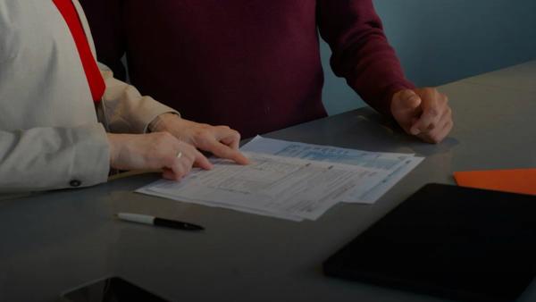 Two people reviewing documents at a table