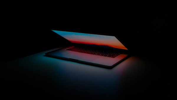 gray and black laptop computer on surface