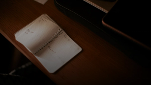 white paper document on brown wooden table