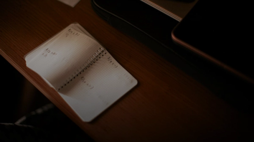 white paper document on brown wooden table