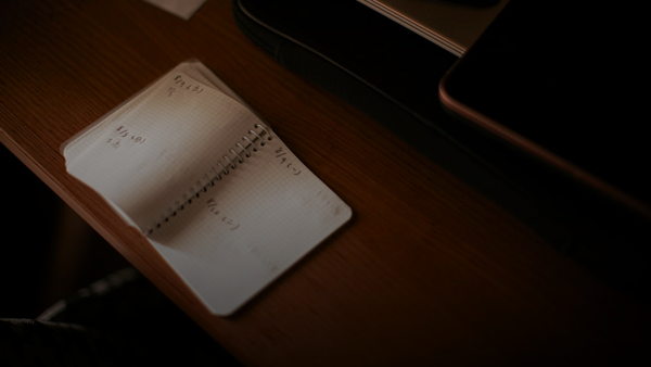 white paper document on brown wooden table