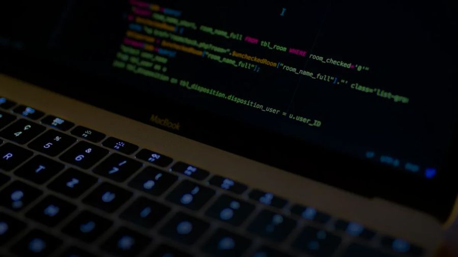 MacBook Pro with images of computer language codes