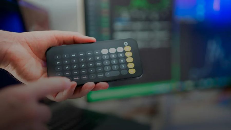 a person holding a remote control in their hand