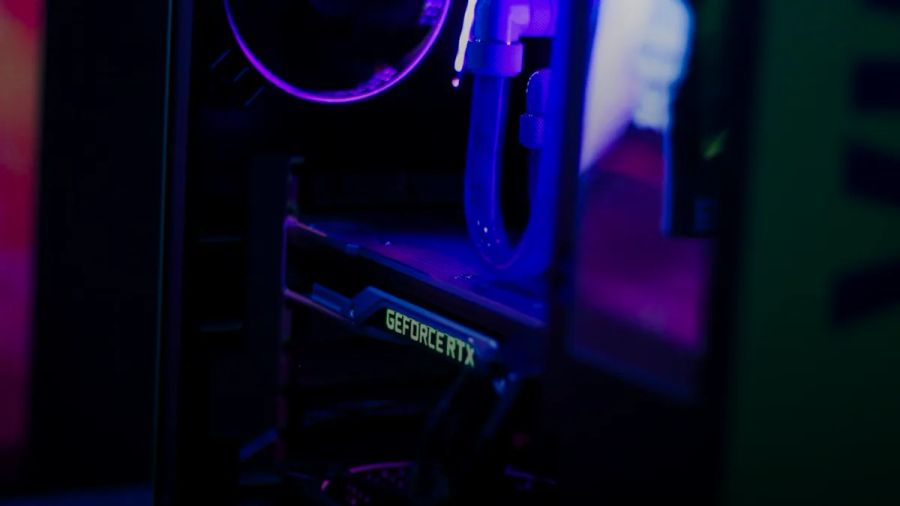 a close up of a computer with a purple light