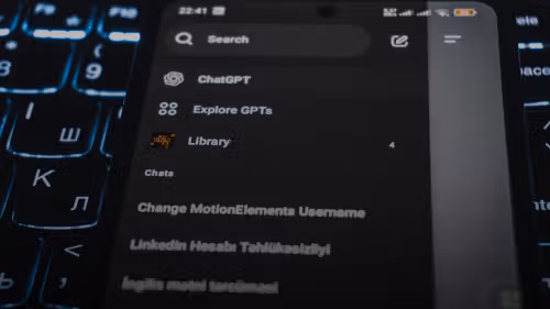 Smartphone screen displaying chatgpt interface on keyboard