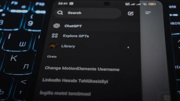 Smartphone screen displaying chatgpt interface on keyboard