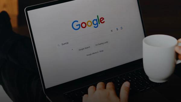 A person sitting in front of a laptop computer