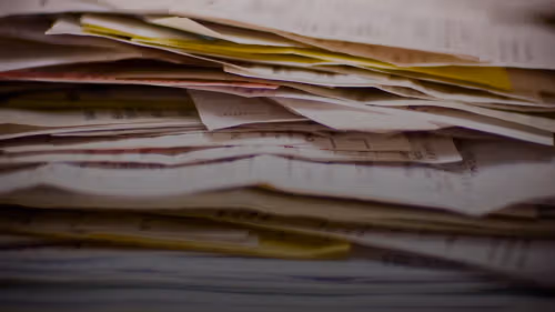 A close-up of a stack of papers.
