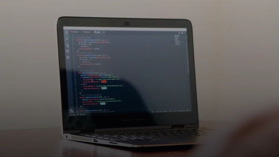 turned-on laptop with computer programming codes display