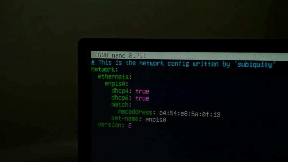 A computer screen displaying network configuration code in a terminal window