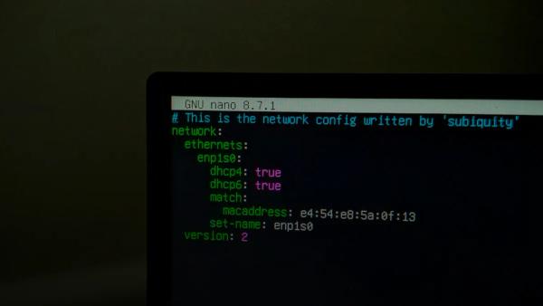 A computer screen displaying network configuration code in a terminal window