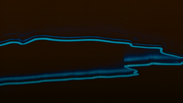 Abstract glowing blue lines on black background