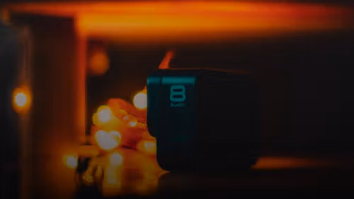 a black speaker sitting on top of a table