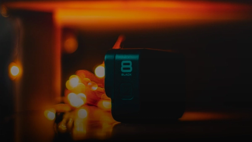 a black speaker sitting on top of a table