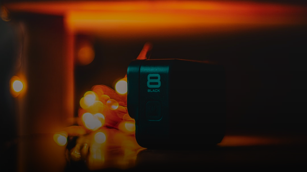 a black speaker sitting on top of a table