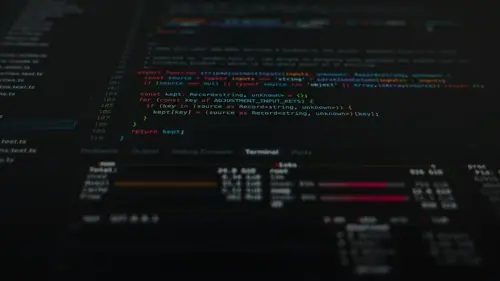 Computer code displayed on a dark screen with a terminal window showing system metrics